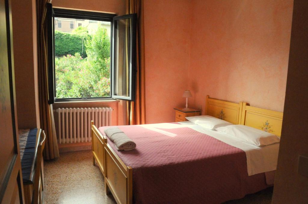 Posteľ alebo postele v izbe v ubytovaní Hotel La Villa