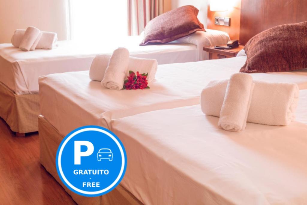 Ένα ή περισσότερα κρεβάτια σε δωμάτιο στο Hotel Bardo Recoletos Coco