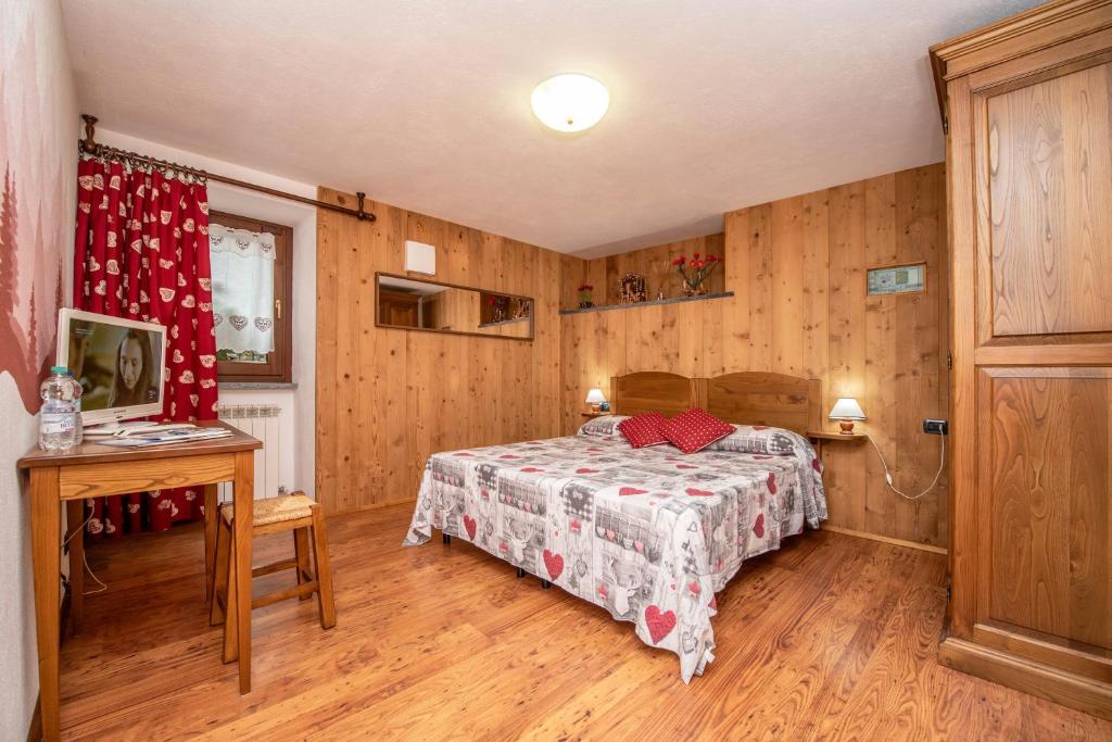 Postel nebo postele na pokoji v ubytování Agriturismo La Clochette
