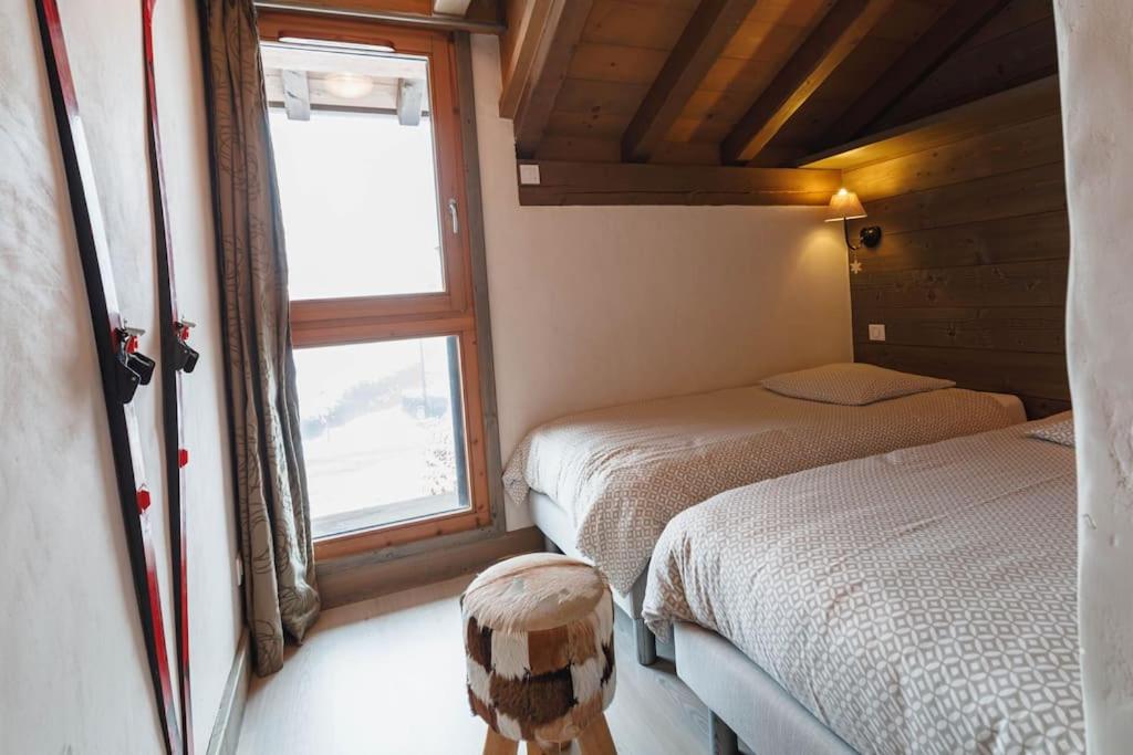 a small room with two beds and a window at Chalet Bio Corti 6p. 3 ch proche pistes&#47;commerces in Champagny-en-Vanoise