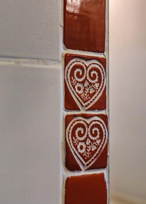 a group of chocolate squares with hearts on a wall at Chalet Bio Corti 6p. 3 ch proche pistes&#47;commerces in Champagny-en-Vanoise