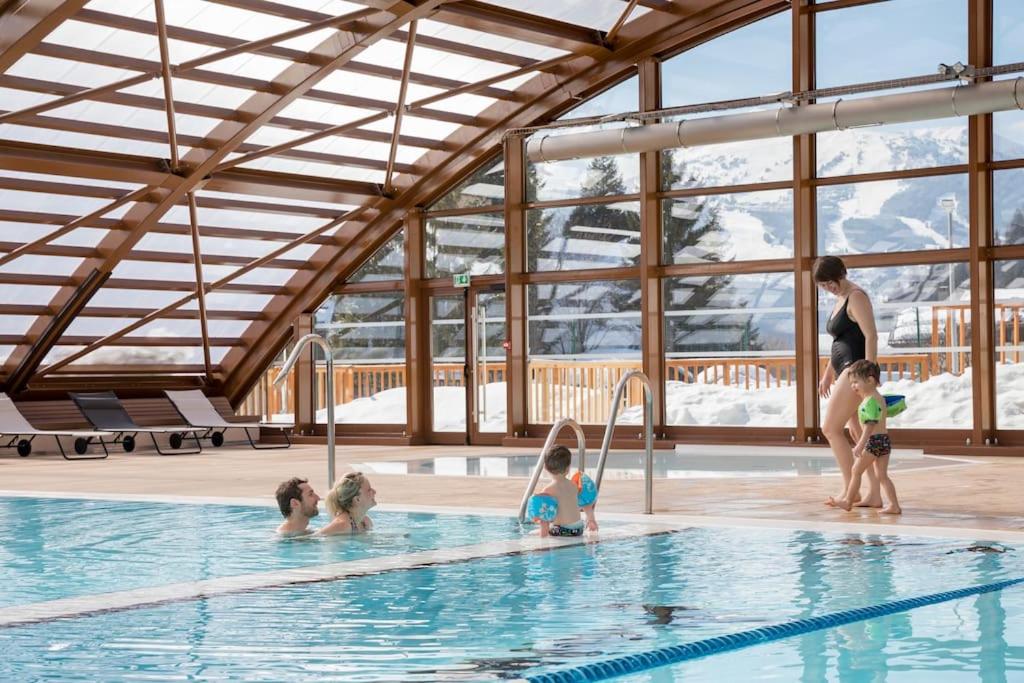 a group of children playing in a swimming pool at Chalet Bio Corti 6p. 3 ch proche pistes&#47;commerces in Champagny-en-Vanoise