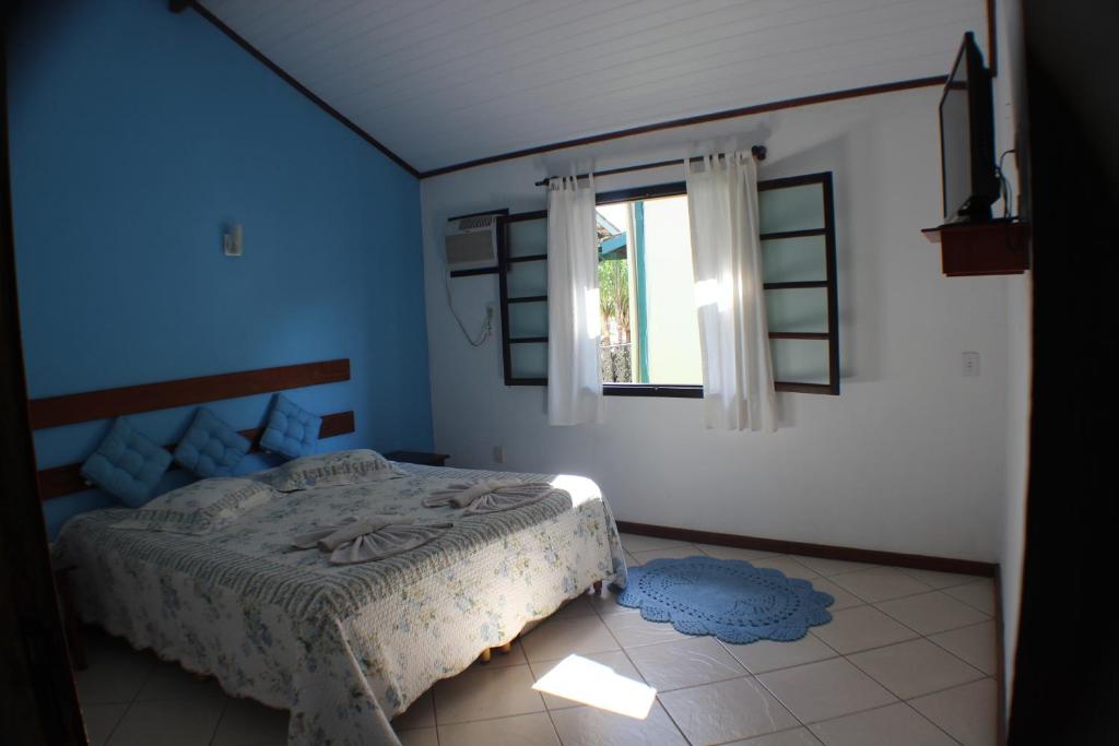 Postel nebo postele na pokoji v ubytování Pousada Flor de Paraty
