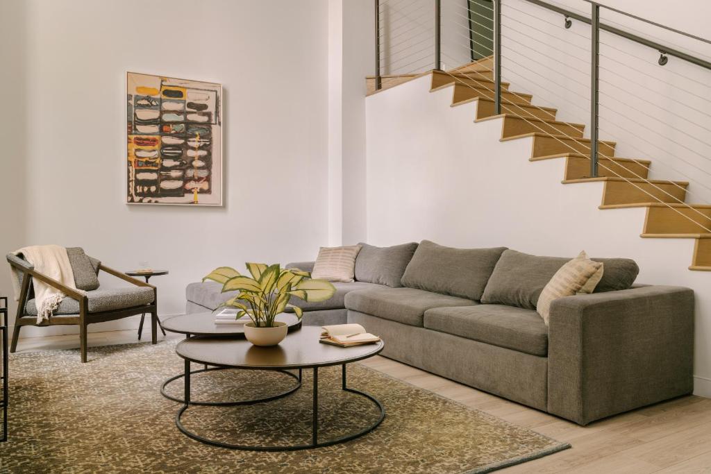 a living room with a couch and a table at Sonder The Witherspoon in Philadelphia