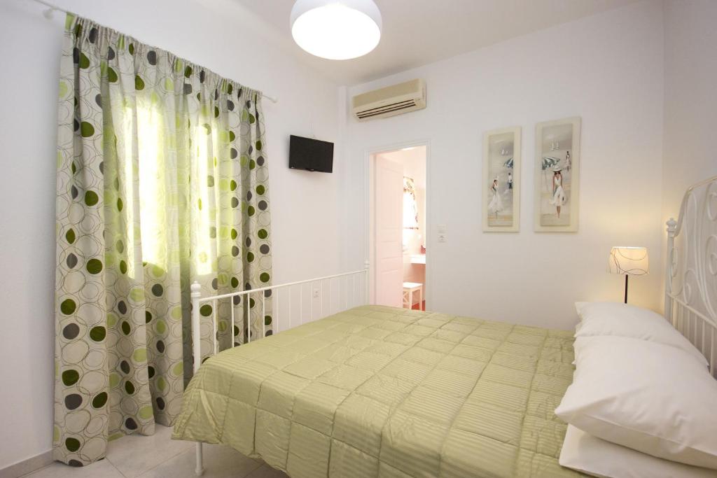 Postel nebo postele na pokoji v ubytování Anixi Hotel