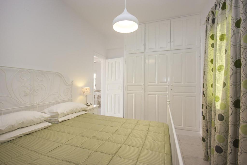Postel nebo postele na pokoji v ubytování Anixi Hotel