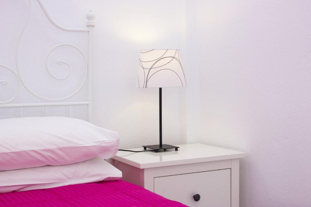 Postel nebo postele na pokoji v ubytování Anixi Hotel