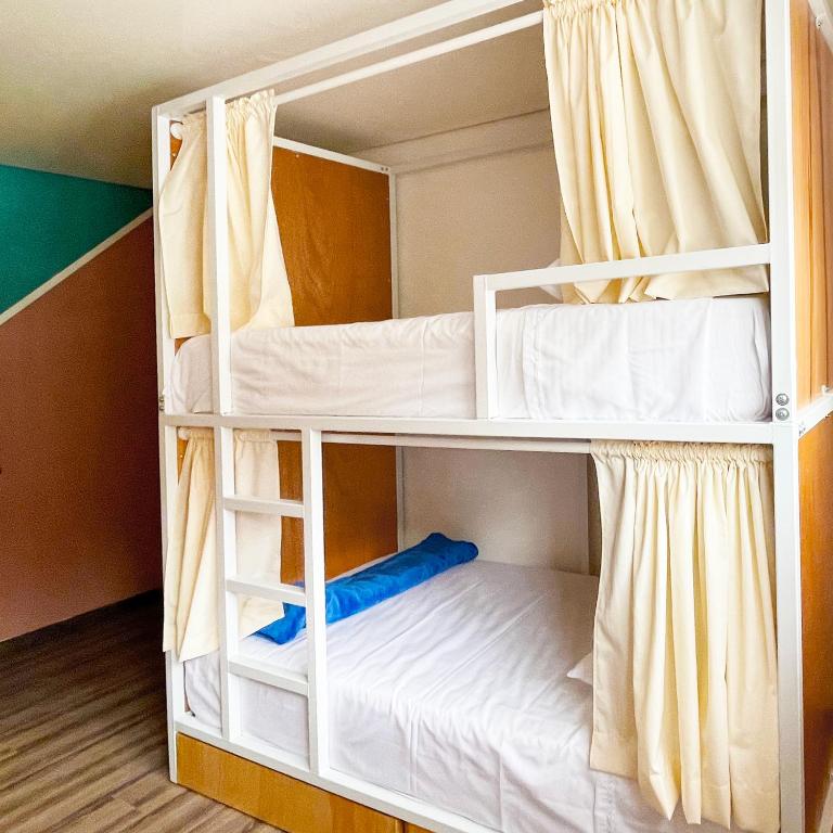 Postel nebo postele na pokoji v ubytování Hostal Macondo Bogotá