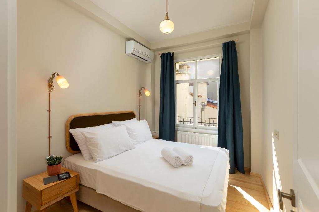 Postel nebo postele na pokoji v ubytování Lemon Apartments