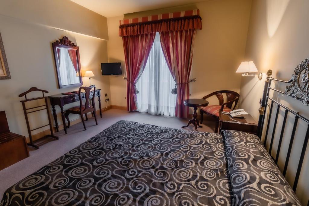 Postel nebo postele na pokoji v ubytování Hotel Alhama