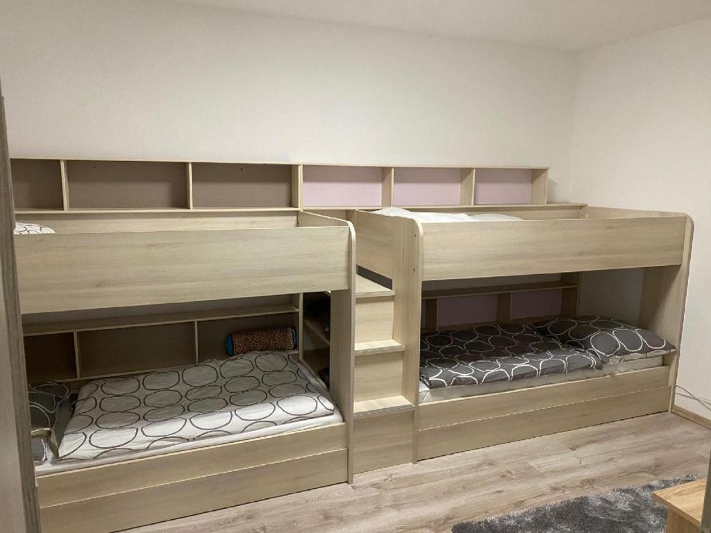 Postel nebo postele na pokoji v ubytování Apartmány Čtyřlístek