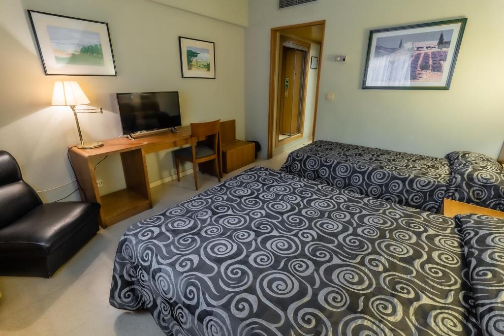Postel nebo postele na pokoji v ubytování Hotel Alhama
