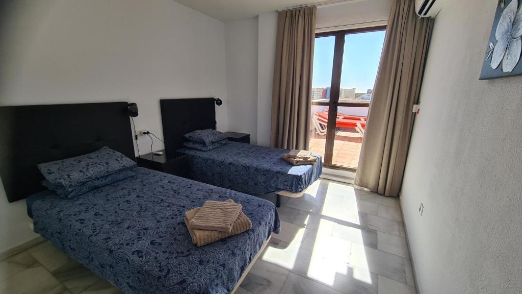 Posteľ alebo postele v izbe v ubytovaní Penthouse at Pueblo Evita