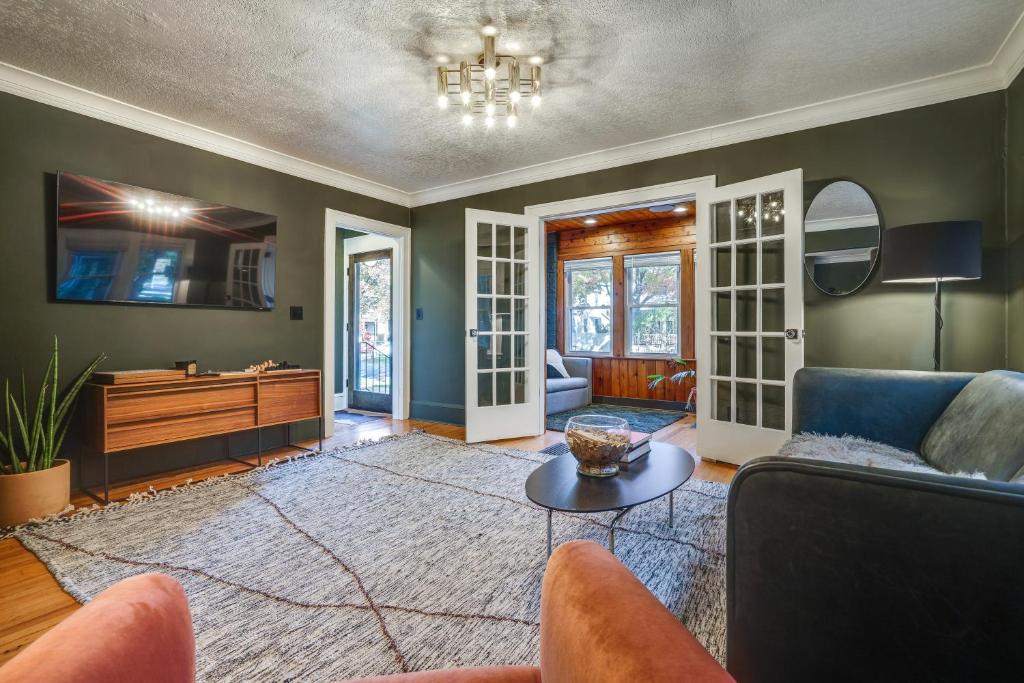 a living room with a couch and a table at Pet-Friendly Saint Paul Rental Near Downtown! in Saint Paul