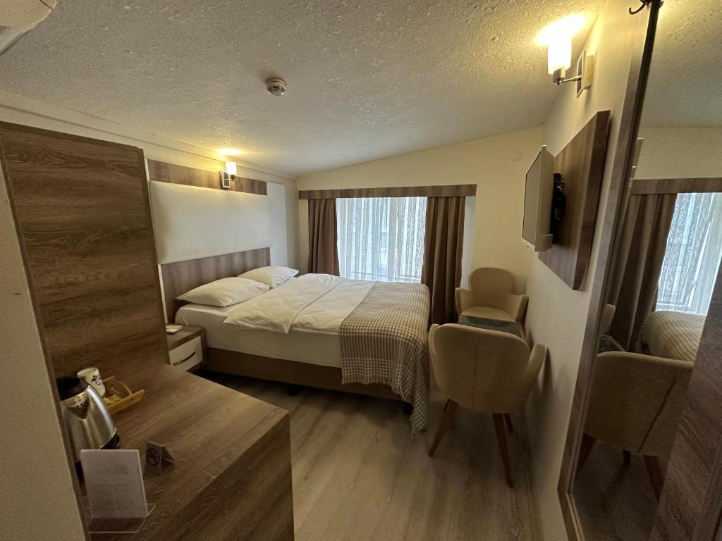 Postel nebo postele na pokoji v ubytování Line Suite Hotel