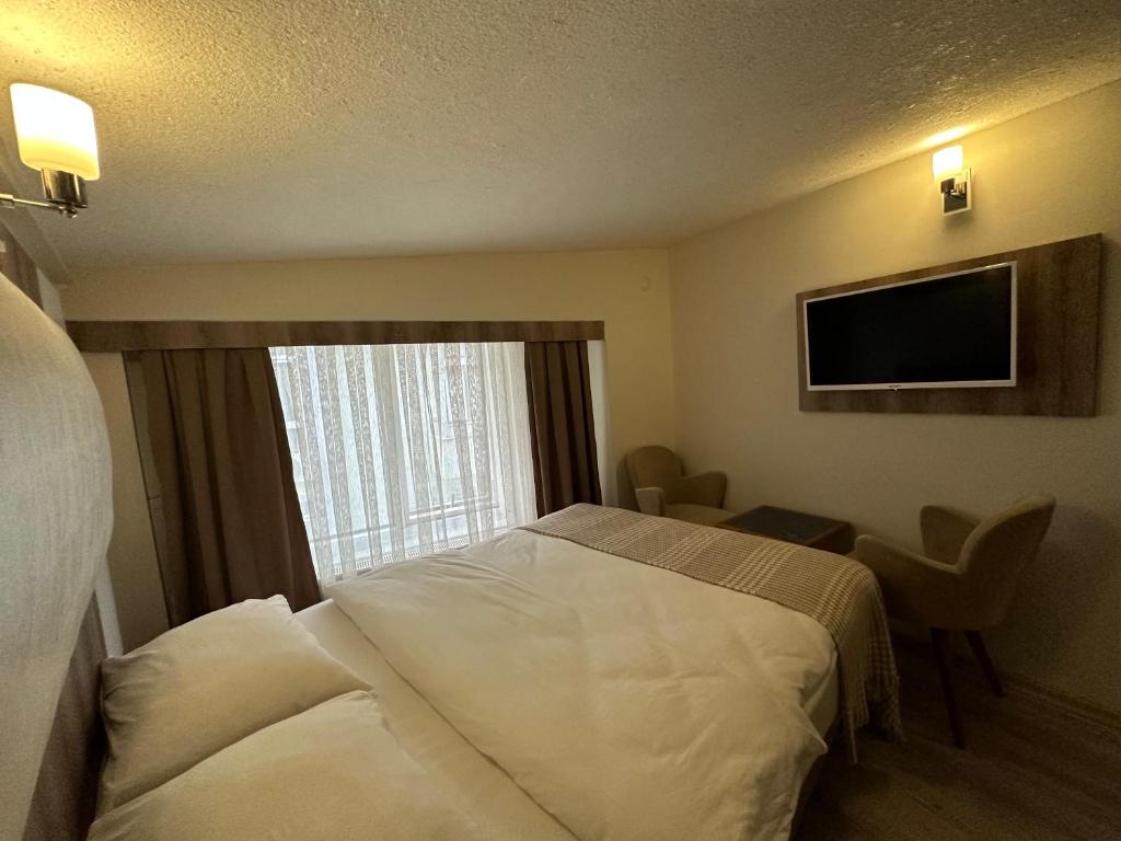 Postel nebo postele na pokoji v ubytování Line Suite Hotel