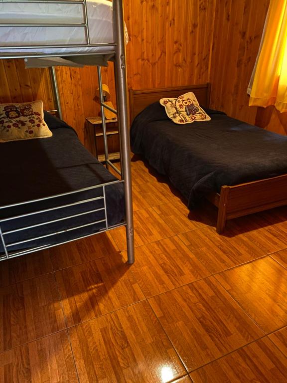 Postel nebo postele na pokoji v ubytování Portal Costanera Caburgua