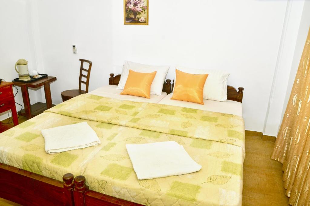 Postel nebo postele na pokoji v ubytování Paradise Inn
