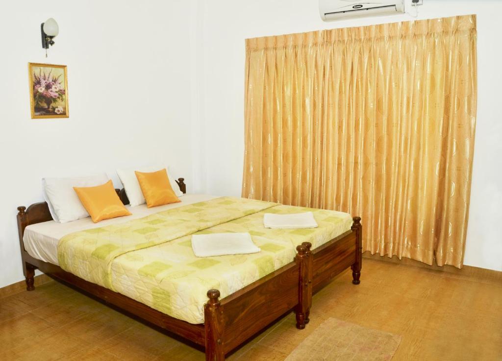 Postel nebo postele na pokoji v ubytování Paradise Inn