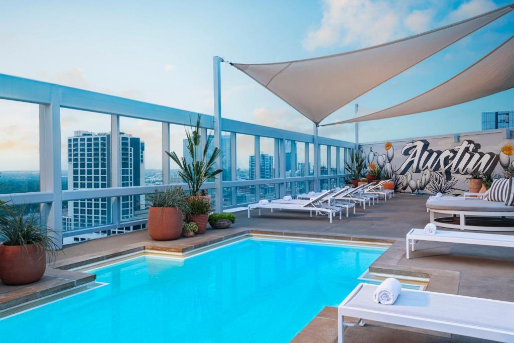 a swimming pool on the roof of a building at Omni Austin Hotel Downtown in Austin