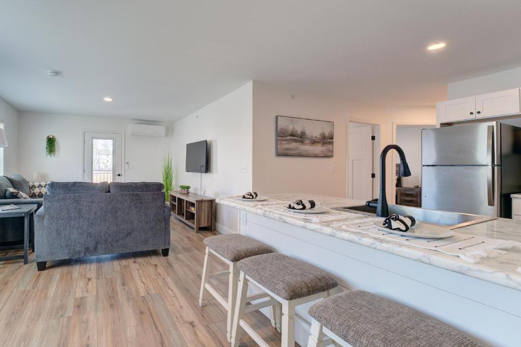 a kitchen and living room with a large counter top at Nature Immersion Tranquil 2-BR Gem Auburn, ME, 2BD, 1BA with Free Parking & WiFi in Auburn