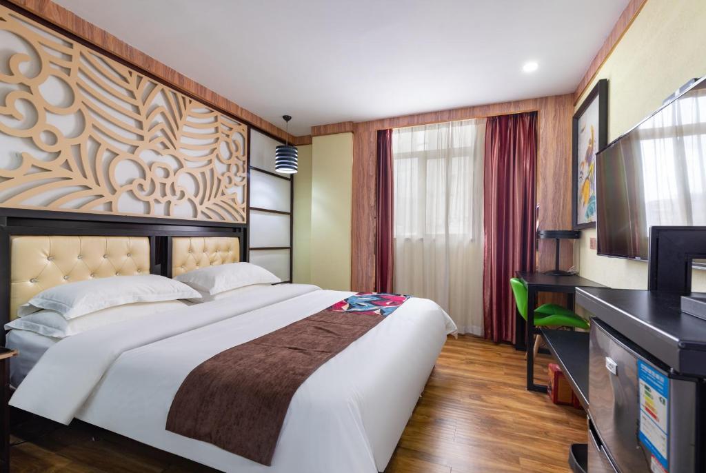 Postel nebo postele na pokoji v ubytování Guangzhou Bird Island Hotel