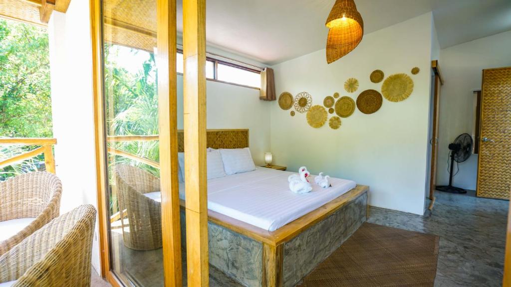Postel nebo postele na pokoji v ubytování Serenity Hotel