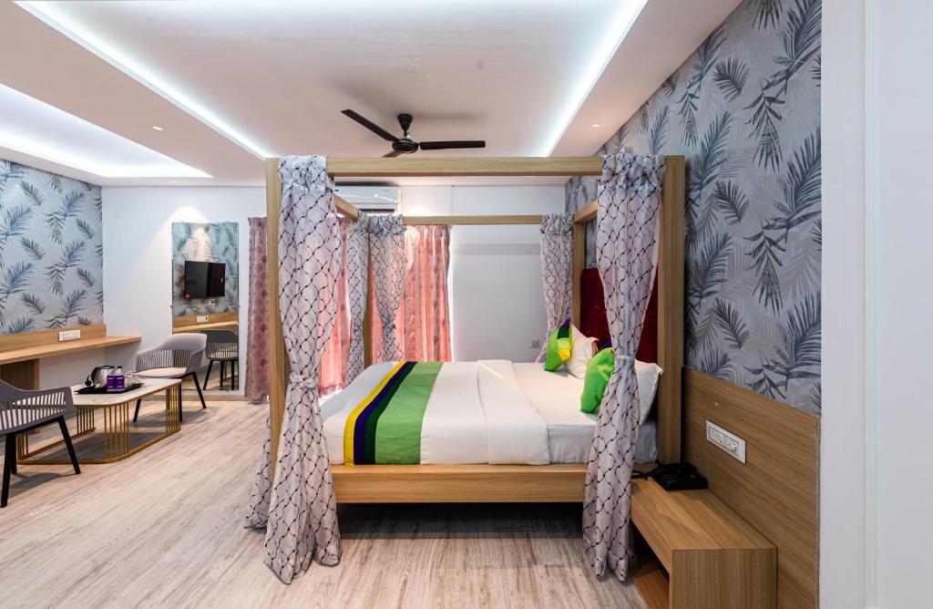 Postel nebo postele na pokoji v ubytování Treebo Cocostay, Hadapsar