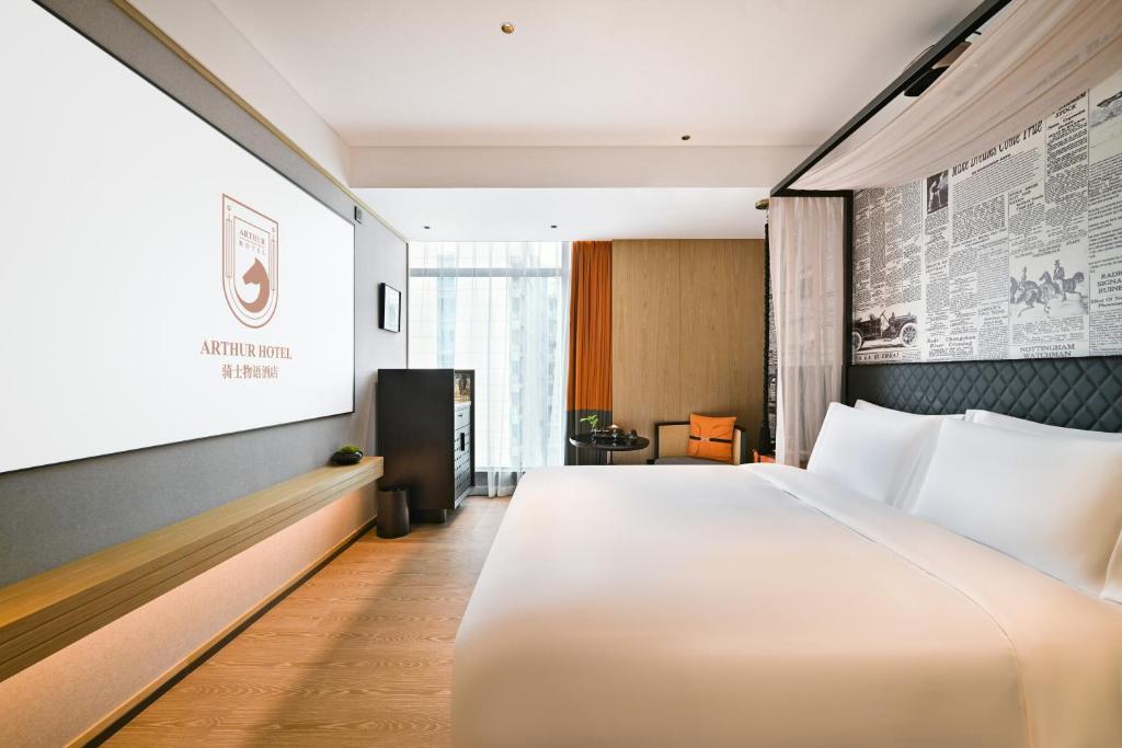 Postel nebo postele na pokoji v ubytování Arthur Hotel Luogang Xiangang Metro Guangzhou-Free Breakfast and Free Afternoon Tea