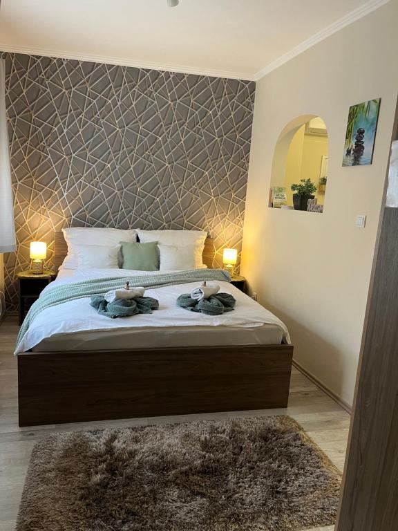 Postel nebo postele na pokoji v ubytování Oreo Apartman