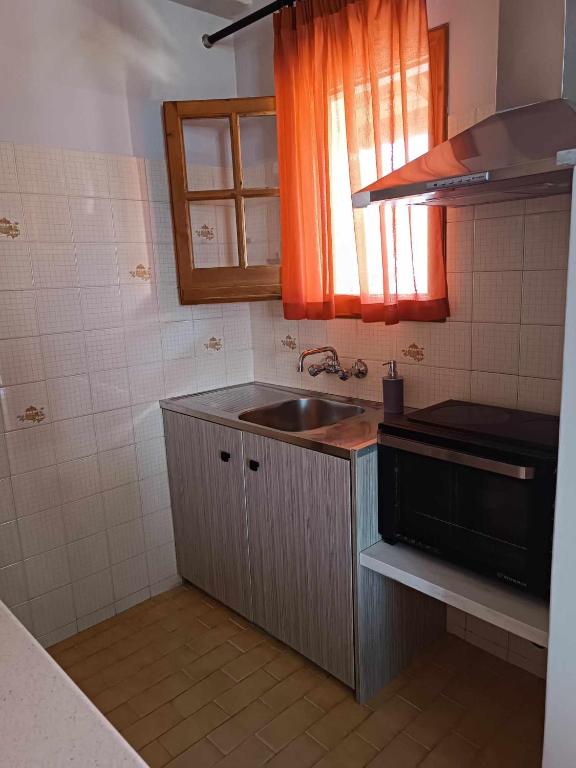 Kuchyň nebo kuchyňský kout v ubytování Sofia Beach Apartments
