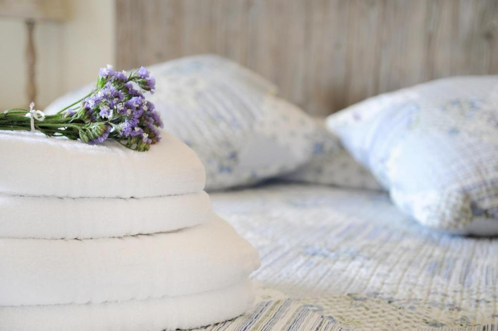 A bed or beds in a room at Triantafilia Guesthouse
