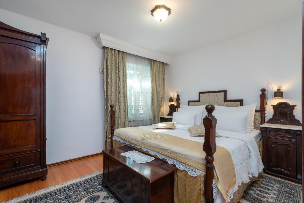 Postel nebo postele na pokoji v ubytování Heritage Hotel Pasike