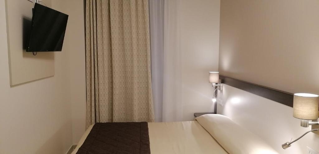 Телевизор и/или развлекательный центр в Hotel Boccascena
