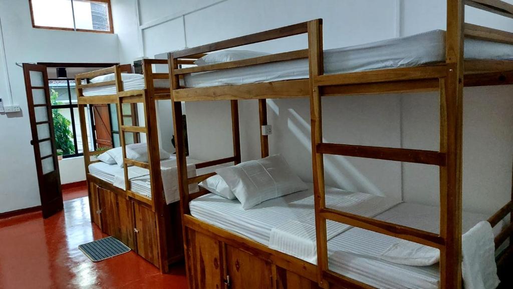 Postel nebo postele na pokoji v ubytování CEYLON STAYZ