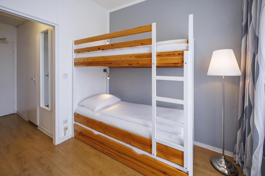 Postel nebo postele na pokoji v ubytování Hotel Lützow