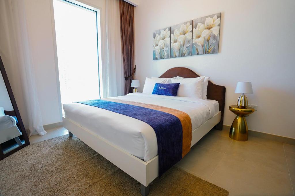 Postel nebo postele na pokoji v ubytování CitiHome- 1BR Dubai Creek Harbour