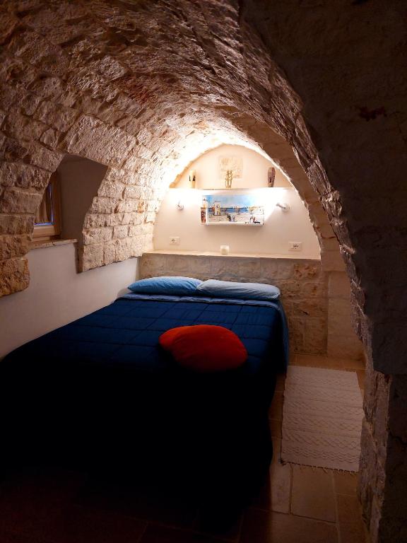 A bed or beds in a room at Ostuni Guest House