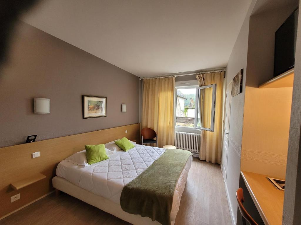 Postel nebo postele na pokoji v ubytování Hotel Fouillade
