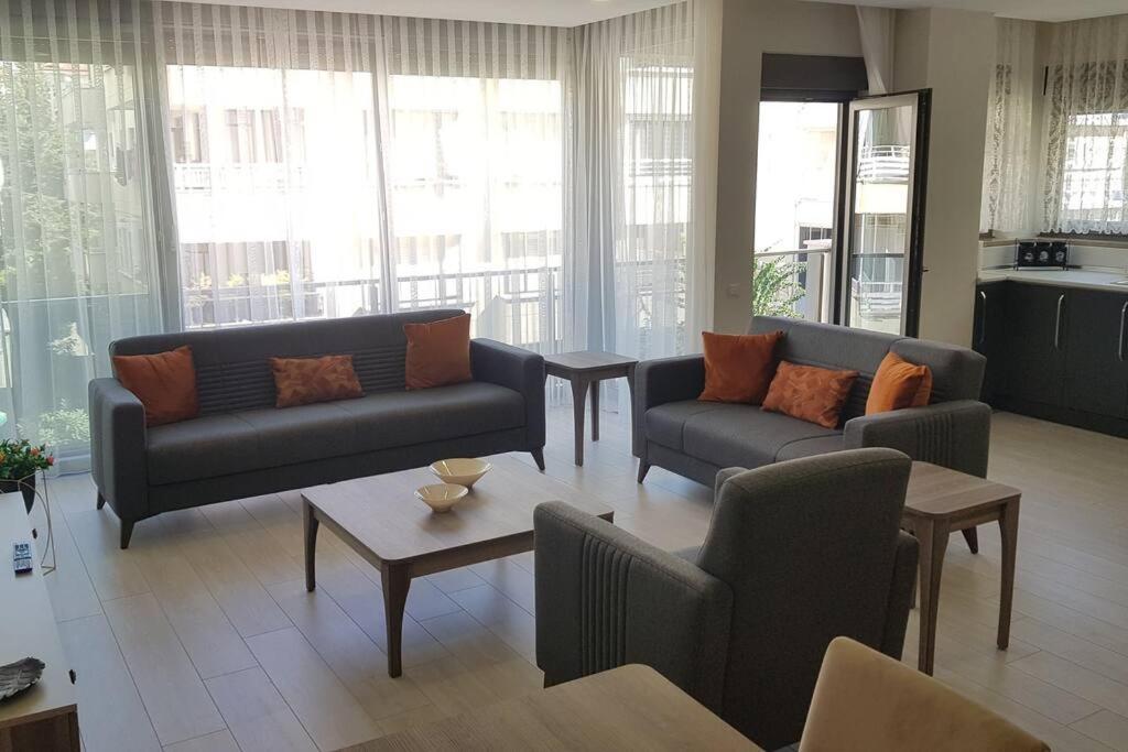 a living room with two couches and a table at 10 Central Location, Close To Beaches And Anywhere in Antalya