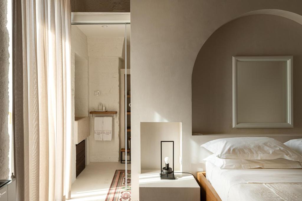 Postel nebo postele na pokoji v ubytování AL PALAZZO La Dimora by Apulia Hospitality