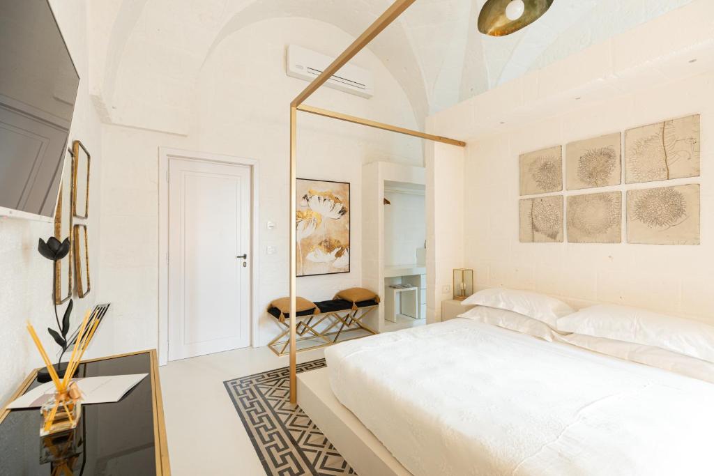 Postel nebo postele na pokoji v ubytování AL PALAZZO La Dimora by Apulia Hospitality