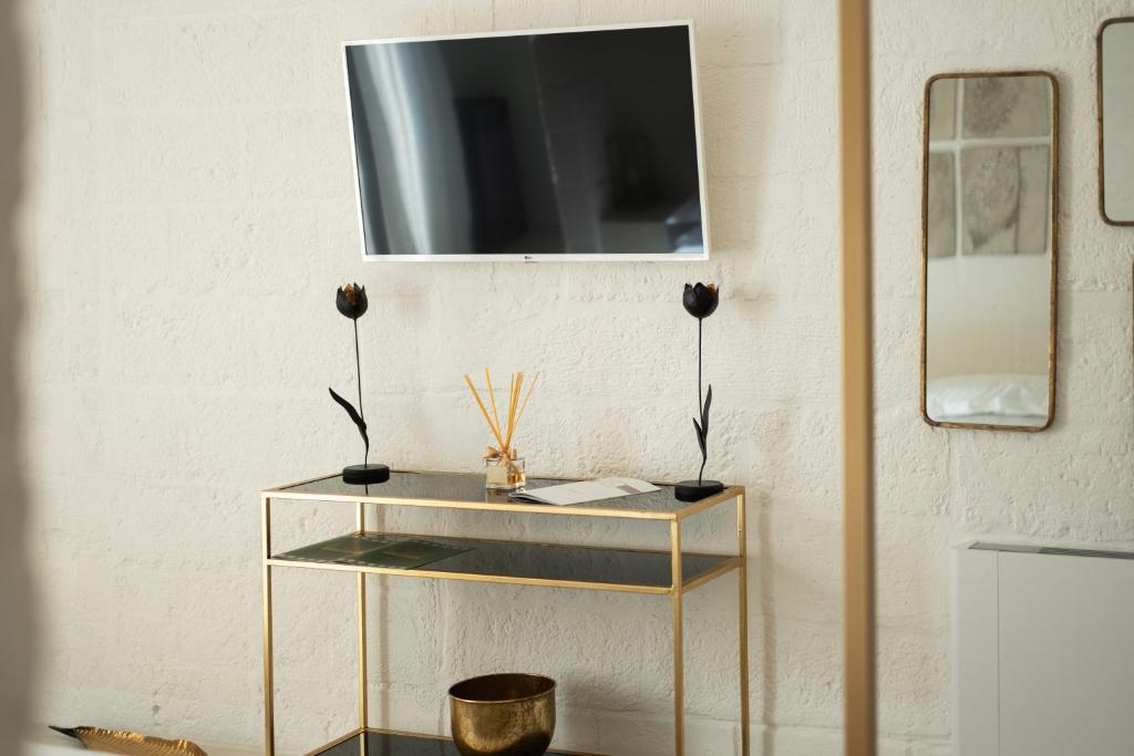 TV a/nebo společenská místnost v ubytování AL PALAZZO La Dimora by Apulia Hospitality