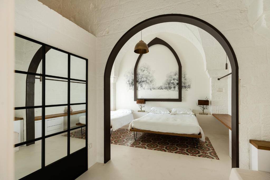Postel nebo postele na pokoji v ubytování AL PALAZZO La Dimora by Apulia Hospitality