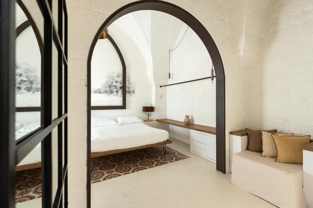 Postel nebo postele na pokoji v ubytování AL PALAZZO La Dimora by Apulia Hospitality