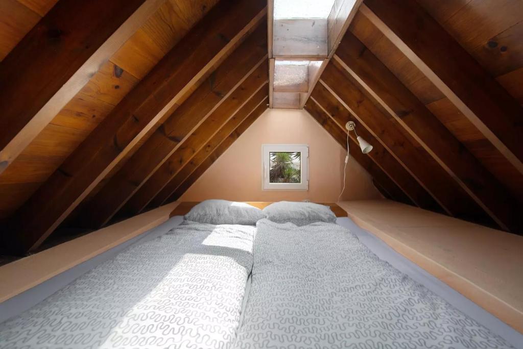 a bedroom with two beds in a attic at Casa Verde in Teguise
