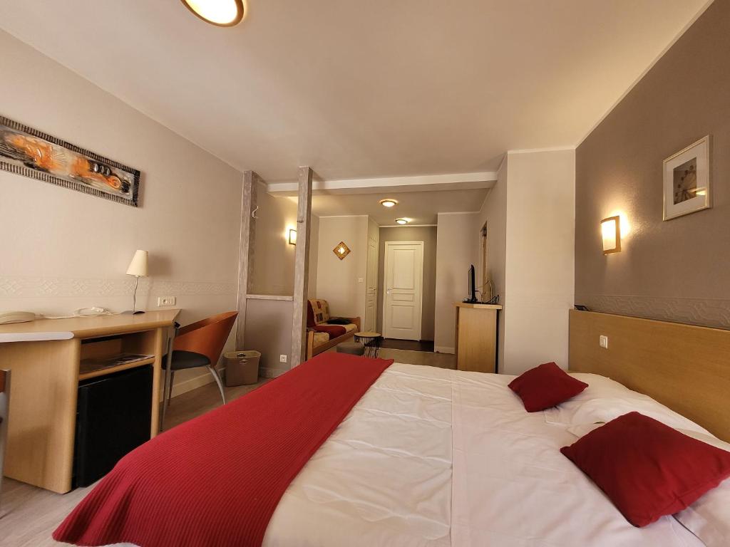 Postel nebo postele na pokoji v ubytování Hotel Fouillade