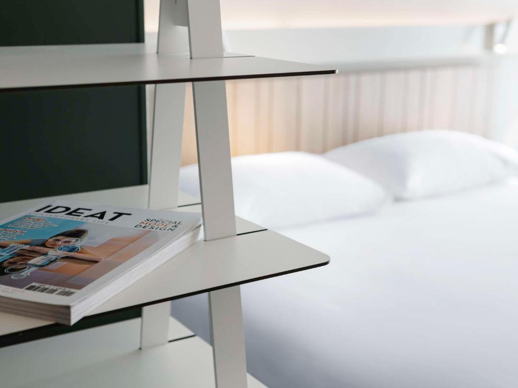 Postel nebo postele na pokoji v ubytování ibis Lyon Est Meyzieu