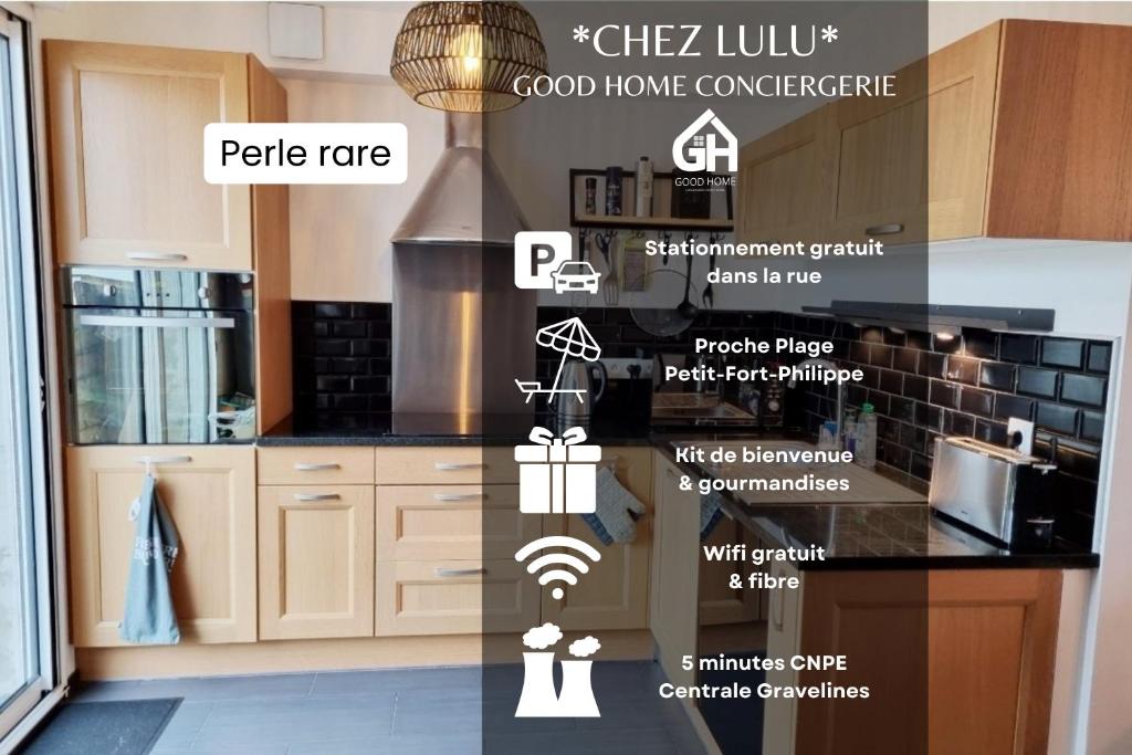 a kitchen with white cabinets and a black counter top at GOOD HOME Chez Lulu, plage & centrale in Gravelines