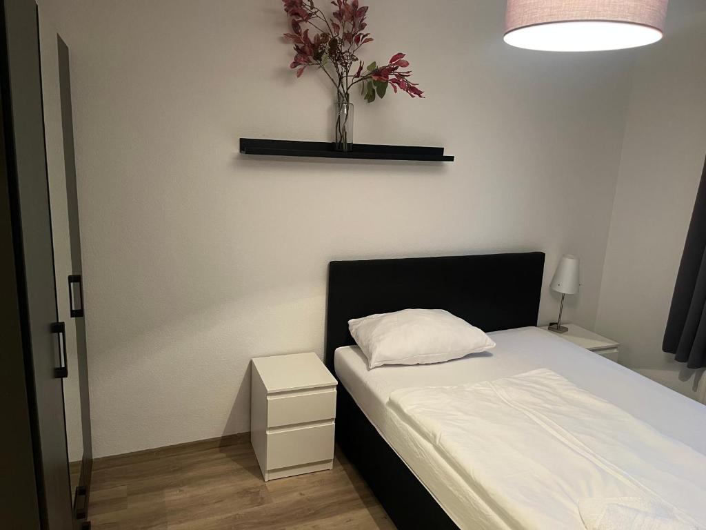 Postel nebo postele na pokoji v ubytování Pharos zur Seeve